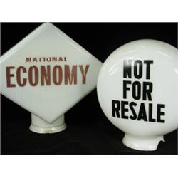 Two glass petrol pump tops: 'National Economy' and 'Not For Resale', (both damaged), tallest 49cm...