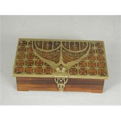 An Art Nouveau rosewood box, the hinged lid with brass inlay and mounts, 18cm wide Est. 80/150...