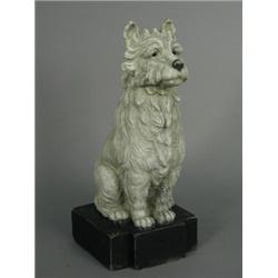 A cast plaster model of a seated terrier dog, 20th century, 28.5cm high Est. 100/150...