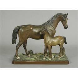A Bergman bronze group of a mare and foal, with painted decoration, base stamped 'Geschutz 3605',...