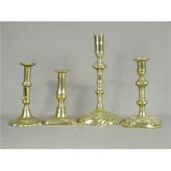 Four 18th century brass candlesticks, highest 23cm Est. 150/180...