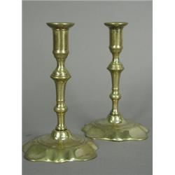 A pair of late 18th century brass tapersticks on metal bases, 12.5cm high Est. 200/300...