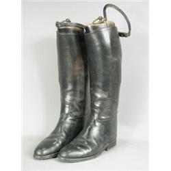 A pair of black leather riding boots, with wooden trees Est. 50/80...