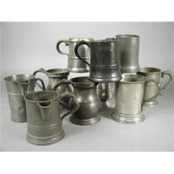 Eight 19th century pewter pint pot tankards and two 19th century pewter pint size jugs, various m...