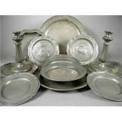 Fourteen pieces of assorted 19th century pewter ware including ten plates, two warming dishes and...