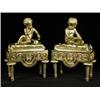 Image 1 : A pair of late 19th/early 20th century French gilt bronze chenets, each with a cherub on a tassel...
