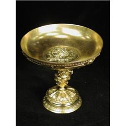 A 19th century bronze tazza, now gilded, cast with a classical mask laurel wreath and cherubs, 14...