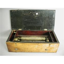 A 19th century six air music box in a fruitwood (?) case, cylinder 20.5cm long, (one tooth missin...
