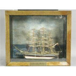 A cased model of The Cutty Sark, built of painted wood, case 44cm high Est. 150/200...