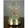 Image 1 : A brass musical automaton modelled as a cage with two birds, with label to reverse, 'The Merry Mu...