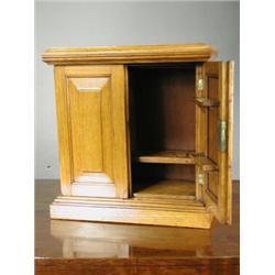 An oak smokers companion cabinet, 33cm Est. 70/90...
