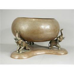 A large 19th century copper bowl inlaid with silver on a matching stand with elephant supports Es...