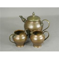 W. A. S. Benson A copper and brass three piece tea service, stamped W.A.S. Benson, teapot 15cm hi...