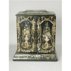 A mid 19th century papier mache and mother of pearl inlaid trinket box, the door opening to revea...