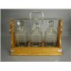 Image 1 : A Victorian/Edwardian tantalus with three cut glass decanters and plated mounts Est. 200/300...