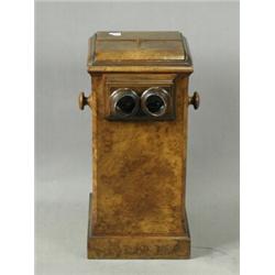 A Victorian burr walnut stereoscope viewer and cards, 54cm high Est. 200/300...
