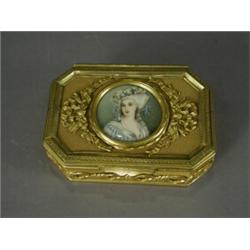 A late 19th century ormolu box, the rectangular top with canted corners, the centre inset with a...