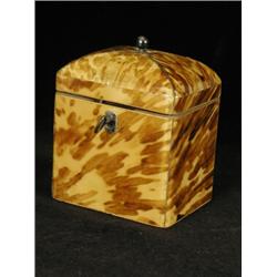 A George III tortoiseshell teacaddy with a domed lid and white metal stringing, with an interior...