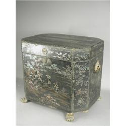 A 19th century oriental lacquered and mother of pearl inlaid 'wig box' with mask handles and claw...