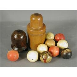Six ivory snooker balls, three others, a treen 'Beehive' string container, a treen bottle contain...