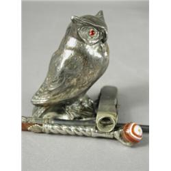 A silver penknife cigar cutter, an owl stamped to the reverse, a silver handled boot pull and a c...