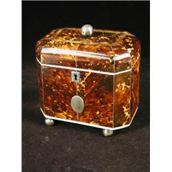 A good George III tortoiseshell teacaddy, the slight domed lid with crossbanding opening to revea...