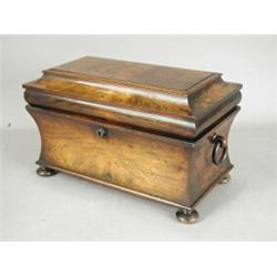 A Regency rosewood tea caddy of sarcophagus shape with two lidded compartments and an associated...
