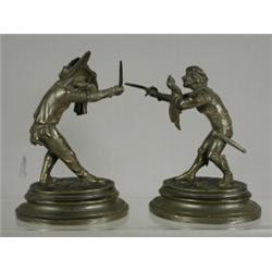 A pair of small 19th century bronzes of fencers on oval bases, each signed E. Guillemin, 13cm hig...