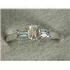 Image 1 : A baguette diamond three stone ring set in 18ct white gold, size O 1/2 Est. 500/700...