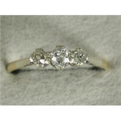 A 9ct gold and platinum three stone diamond ring set with old cut stones, size Q Est. 200/300...