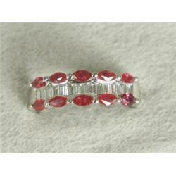 A ruby and diamond dress ring set with ten marquise rubies and fourteen diamonds, set in 18ct whi...