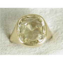 A yellow sapphire (15 x 13mm) solitaire ring, rubover set in 18ct gold, size O Est. 150/250...