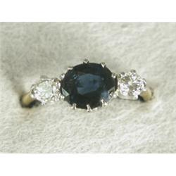 An 18ct gold sapphire and diamond three stone ring, size I 1/2 Est. 400/600...
