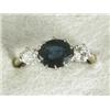 Image 1 : An 18ct gold sapphire and diamond three stone ring, size I 1/2 Est. 400/600...