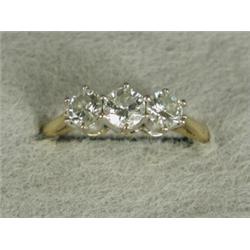 A three stone diamond ring (total approx 1ct) set in 18ct gold, size Q Est. 500/700...