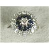Image 1 : A sapphire and diamond cluster ring set with a central diamond of approx 0.25ct and seventeen out...