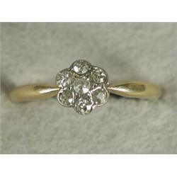 A diamond flower cluster ring set in 18ct gold, size N Est. 60/80...