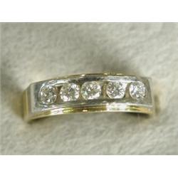 A five stone diamond ring, channel set in 18ct white gold to a yellow shank, size O (total approx...