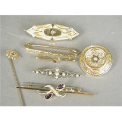 Seven various antique brooches including a 9ct gold bar brooch set with amethysts and seed pearls...