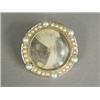 Image 1 : A 14k gold memorial brooch/pendant set with hair within a seed pearl frame, 3cm in diameter (case...