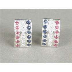 A pair of diamond, sapphire and ruby earrings in 18ct white gold stud mounts Est. 300/400...