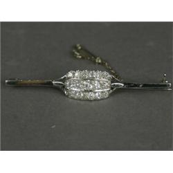 A diamond brooch set with three rows of old cut stones, set in white metal (tests platinum), with...