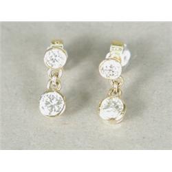 A pair of diamond drop earrings, bezel set in 9ct gold (total approx 1.3cts) Est. 800/1000...
