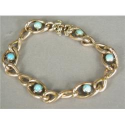 A 9ct gold bracelet set with turquoise cabochons, 18cm long Est. 50/100...