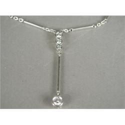 A four stone diamond drop pendant and chain set in 18ct white gold (total diamond weight approx 1...
