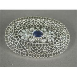 A sapphire and diamond filigree brooch set in 9ct white gold, 5cm long Est. 200/250...