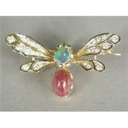 A butterfly brooch set with diamonds, emeralds, a cabochon ruby and an opal doublet, in yellow me...