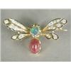 Image 1 : A butterfly brooch set with diamonds, emeralds, a cabochon ruby and an opal doublet, in yellow me...