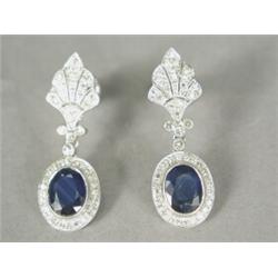 A pair of sapphire and diamond cluster drop earrings, set in 18ct white gold, the pierced mounts...