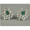 Image 1 : A pair of emerald and diamond cluster earrings each set with a central pear shape emerald and pea...